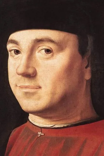 Portrait d'homme d'Antonello da Messina : un visage de trois quarts, bonnet noir et pourpoint rouge, le regard tourné vers le spectateur.
